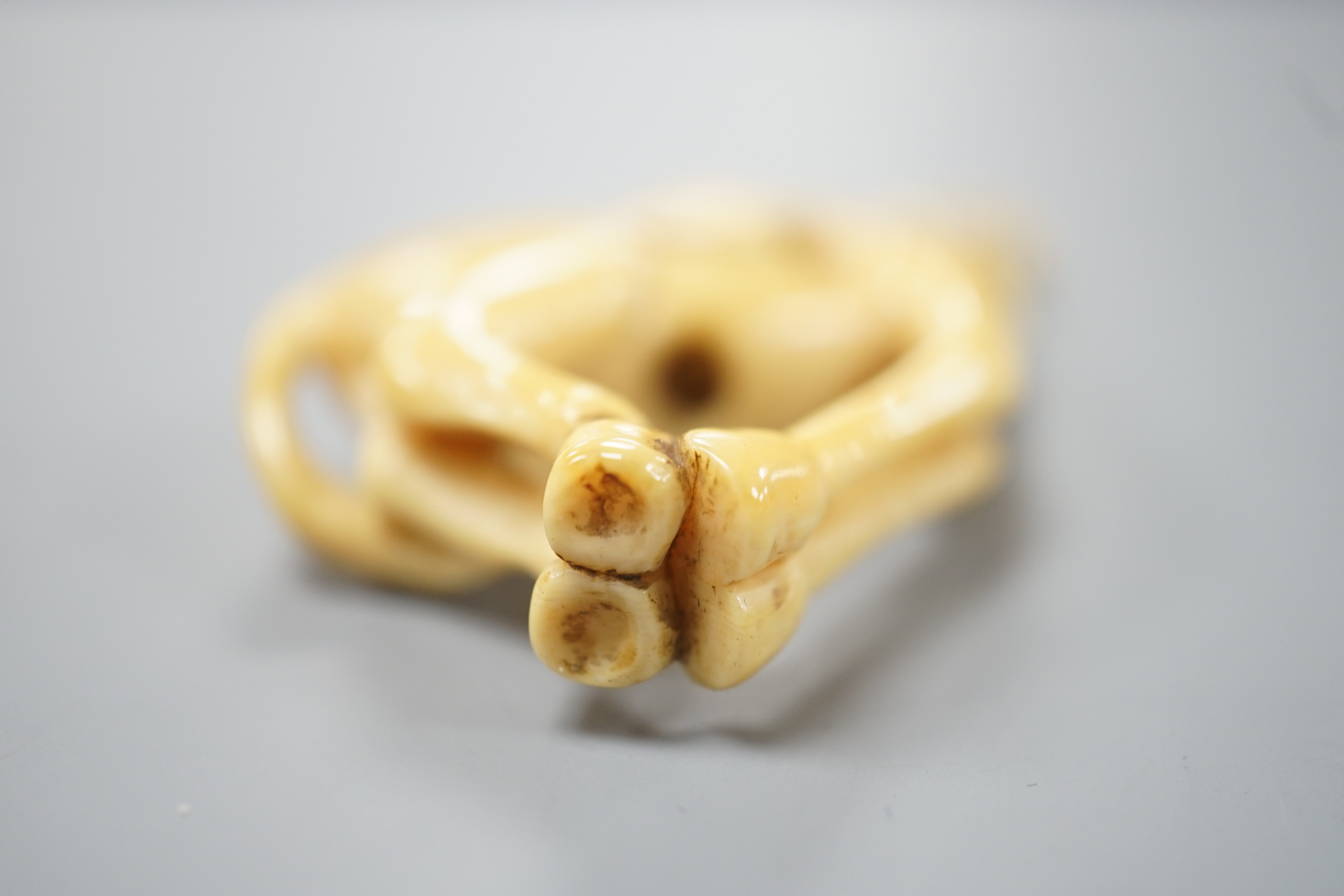 A Japanese ivory netsuke of a horse, late 18th/early 19th century, lacking rider and re-shaped at the saddle, 6cm